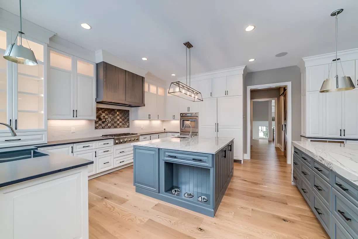 Two-tone cabinet design with navy blue lowers and white uppers by a painting company in Grover Beach, CA