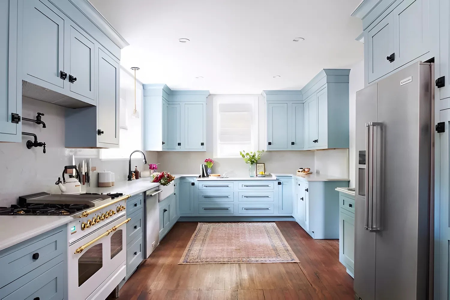 Light blue kitchen cabinets with a smooth satin finish painted by a house painter in Los Osos, CA
