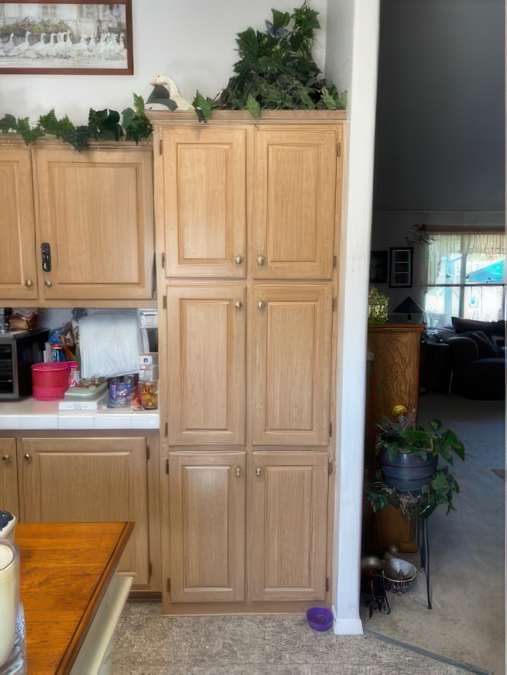Refinished tall built-in cabinets painting close-up Refinished tall cabinets with detail