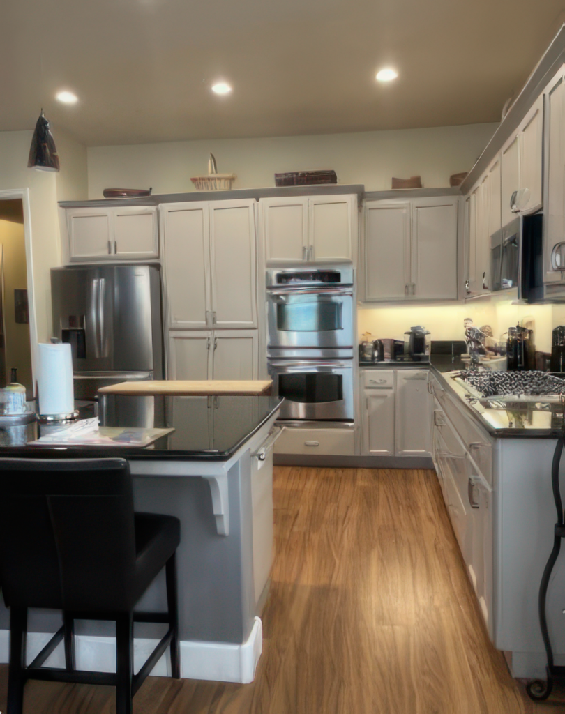 Modern Kitchen with Elegant Light Gray Cabinet Painting A contemporary kitchen featuring newly painted light gray cabinets and modern stainless steel appliances.