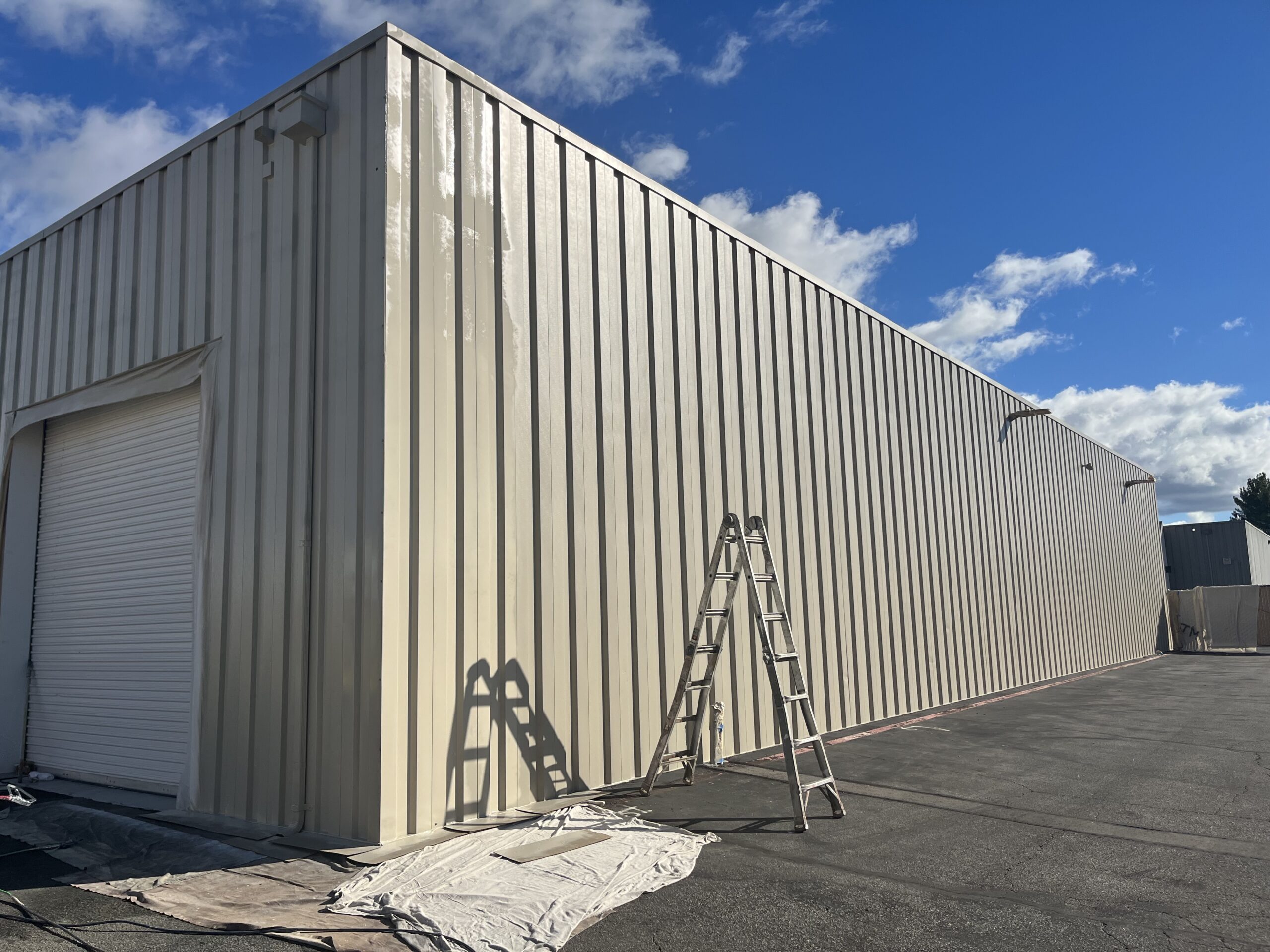 Standing seam metal commercial building exterior painting Standing seam metal building exterior