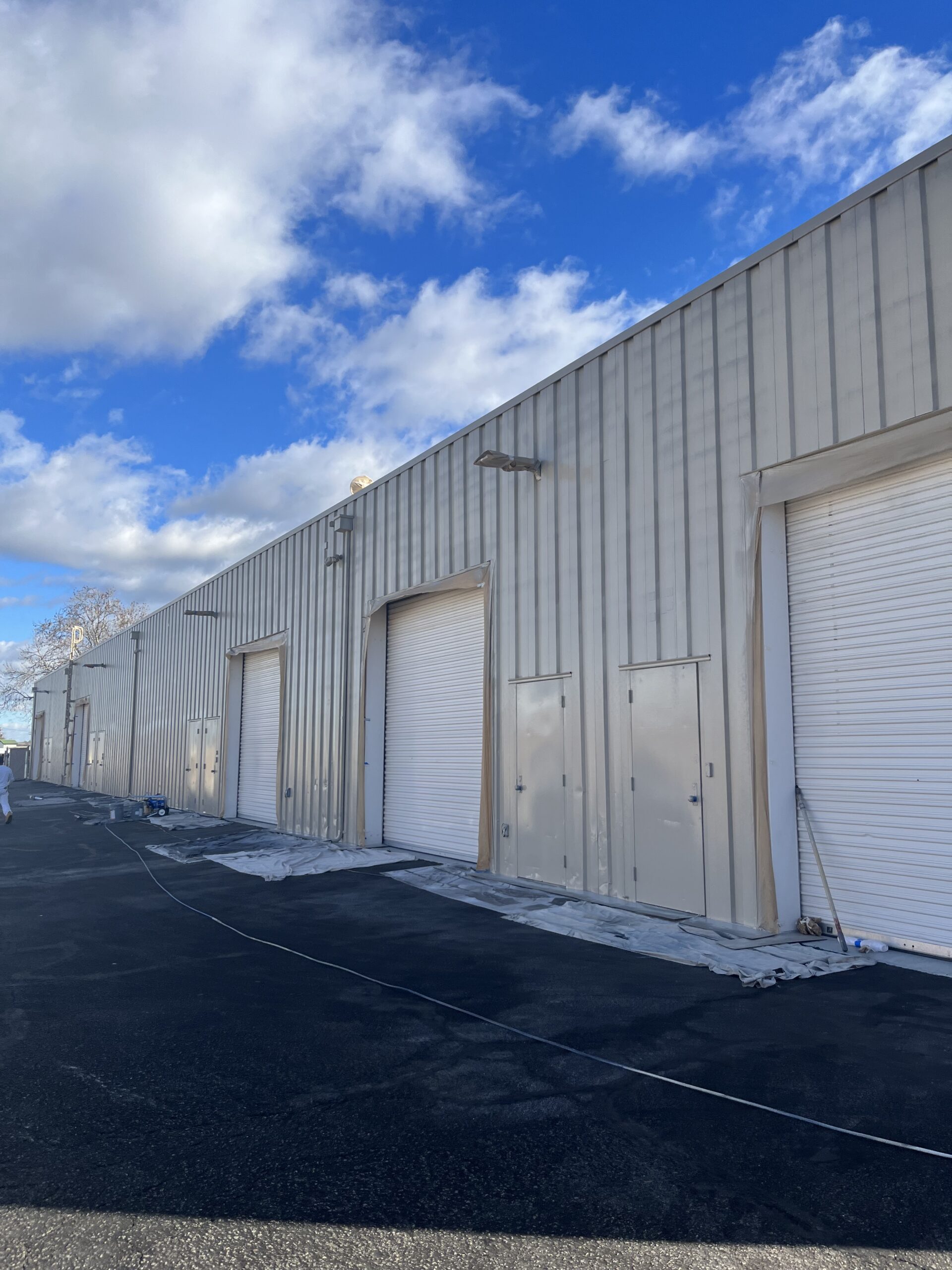 White industrial warehouse commercial exterior painting White industrial warehouse exterior