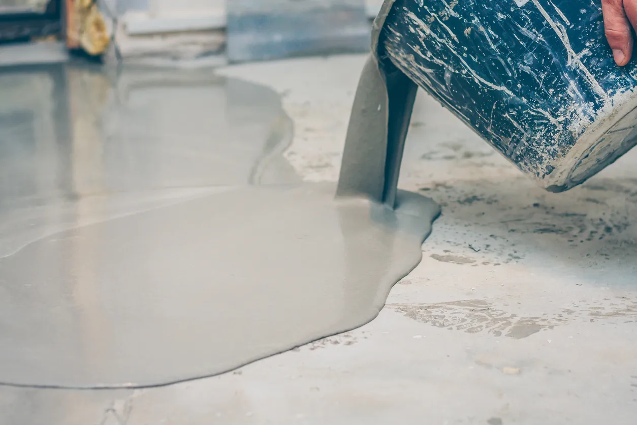Worker applying epoxy floor roller finish coat Epoxy floor roller finish coat