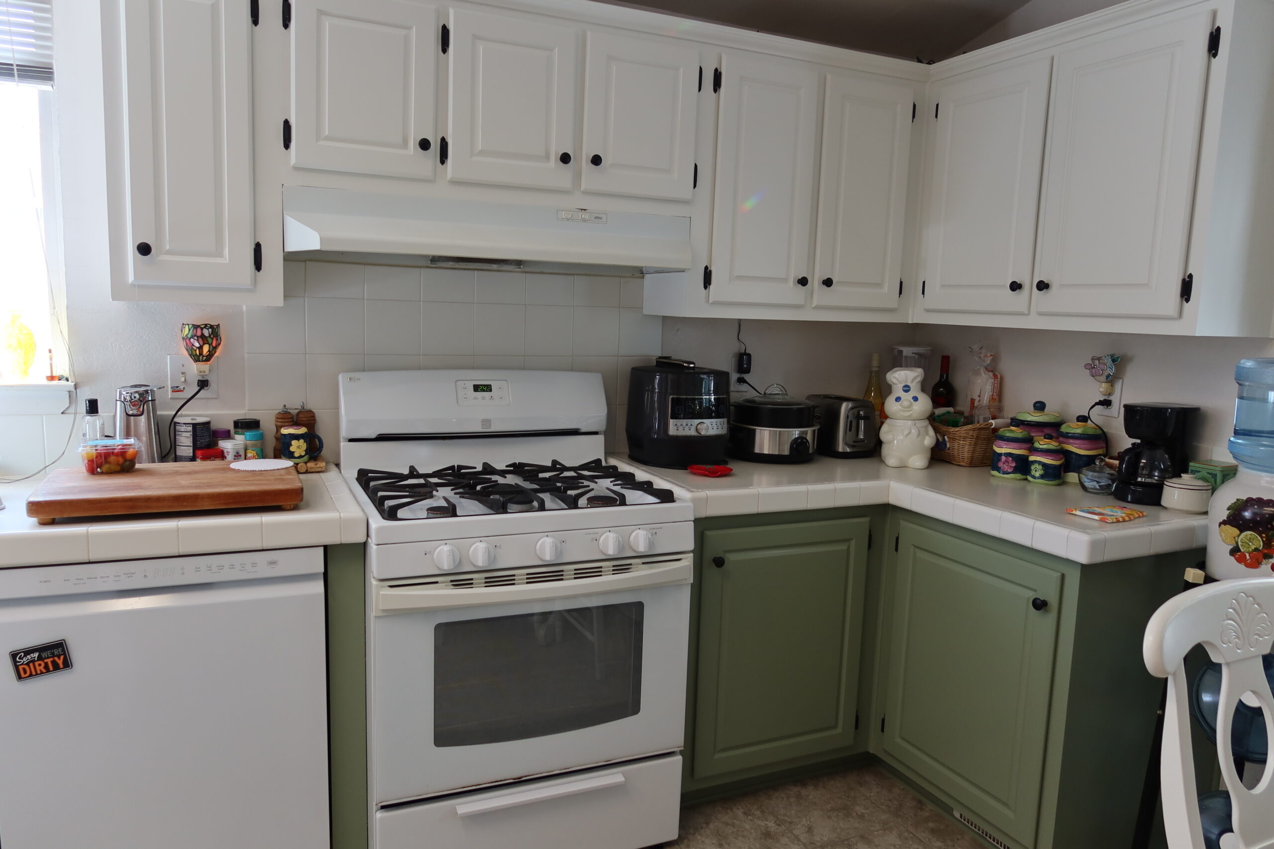 White refinished kitchen cabinets with retro stove White cabinets with retro stove