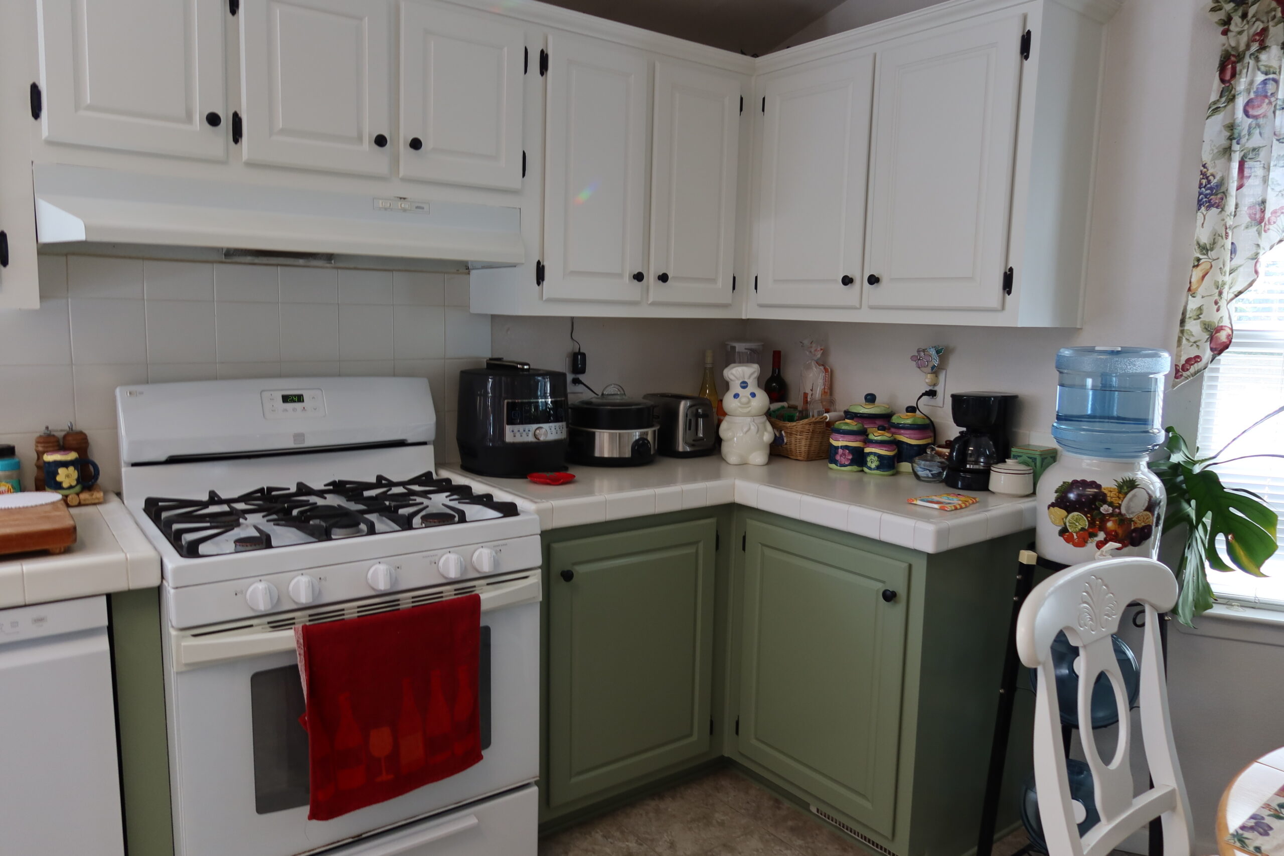 Green kitchen cabinet refinishing project with vintage stove Green kitchen cabinets with stove